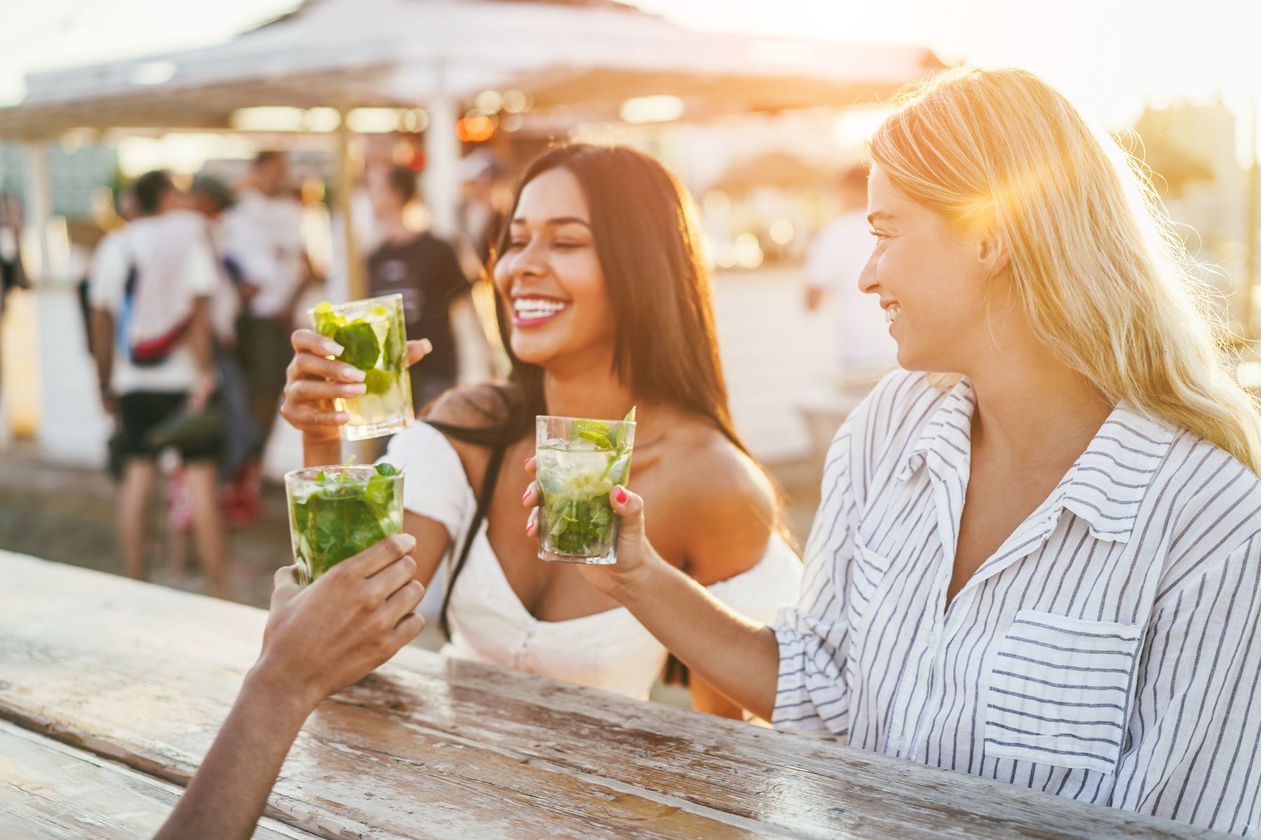 Young women drinking at an outdoor bar in South Padre Island