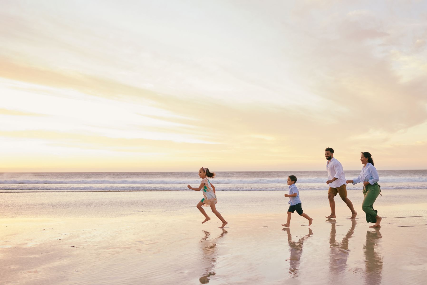 Family running on South Padre Island